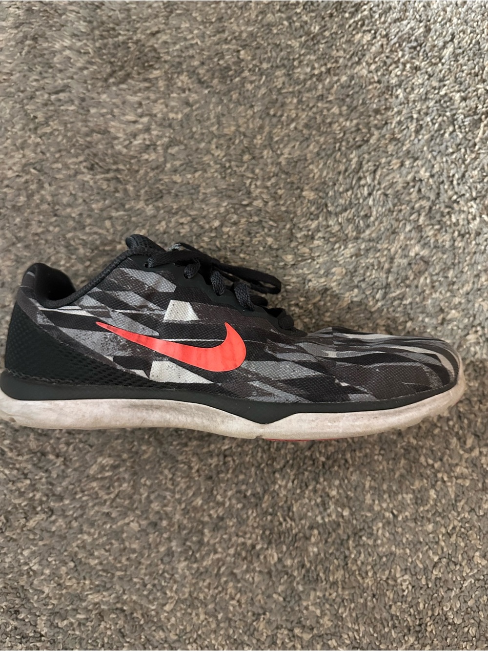 Nike Women’s Black, White and Gray Athletic Shoes with Reddish Swoosh